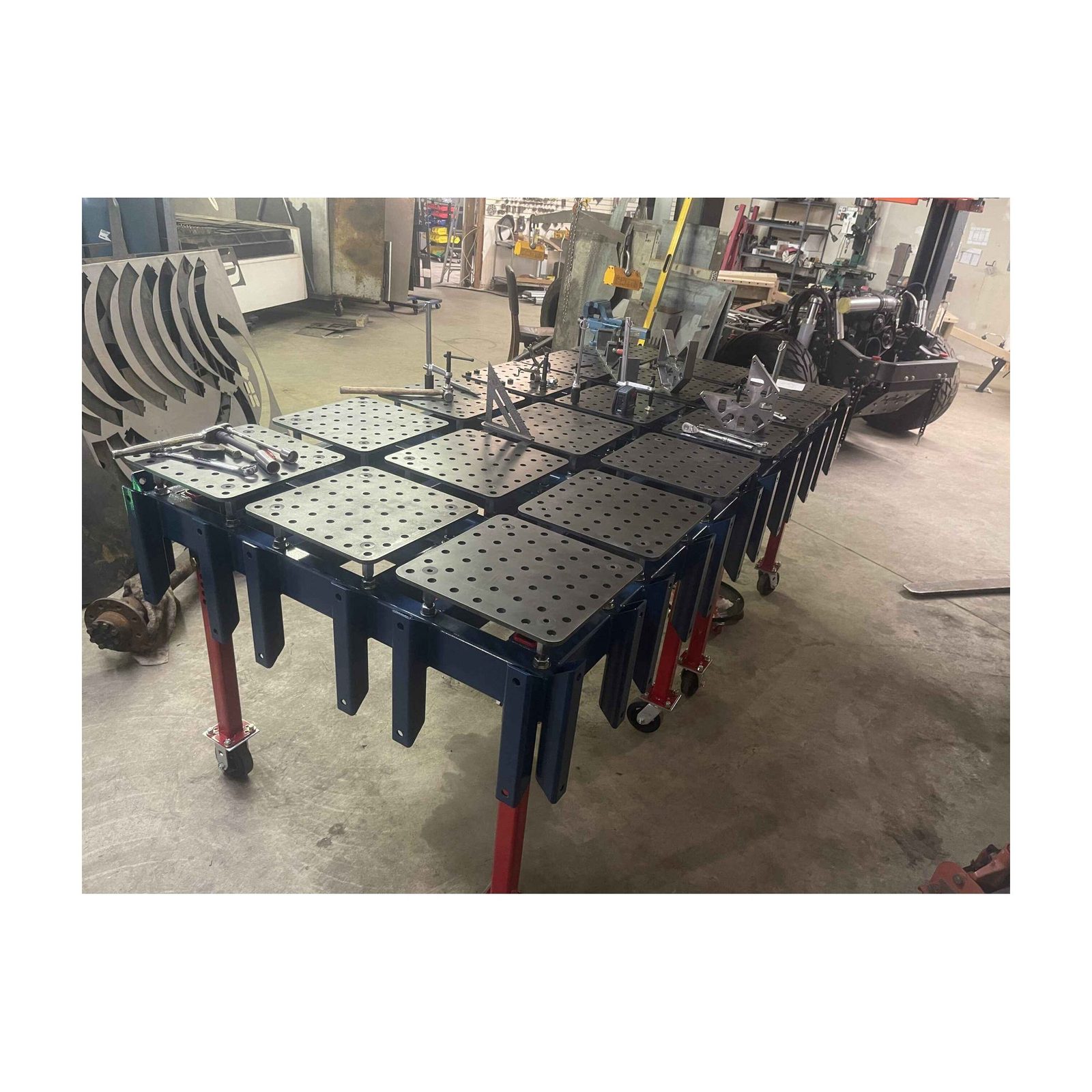 Patriot Chassis full manufacturing facility — laser cutter, press brake, and welding fixtures